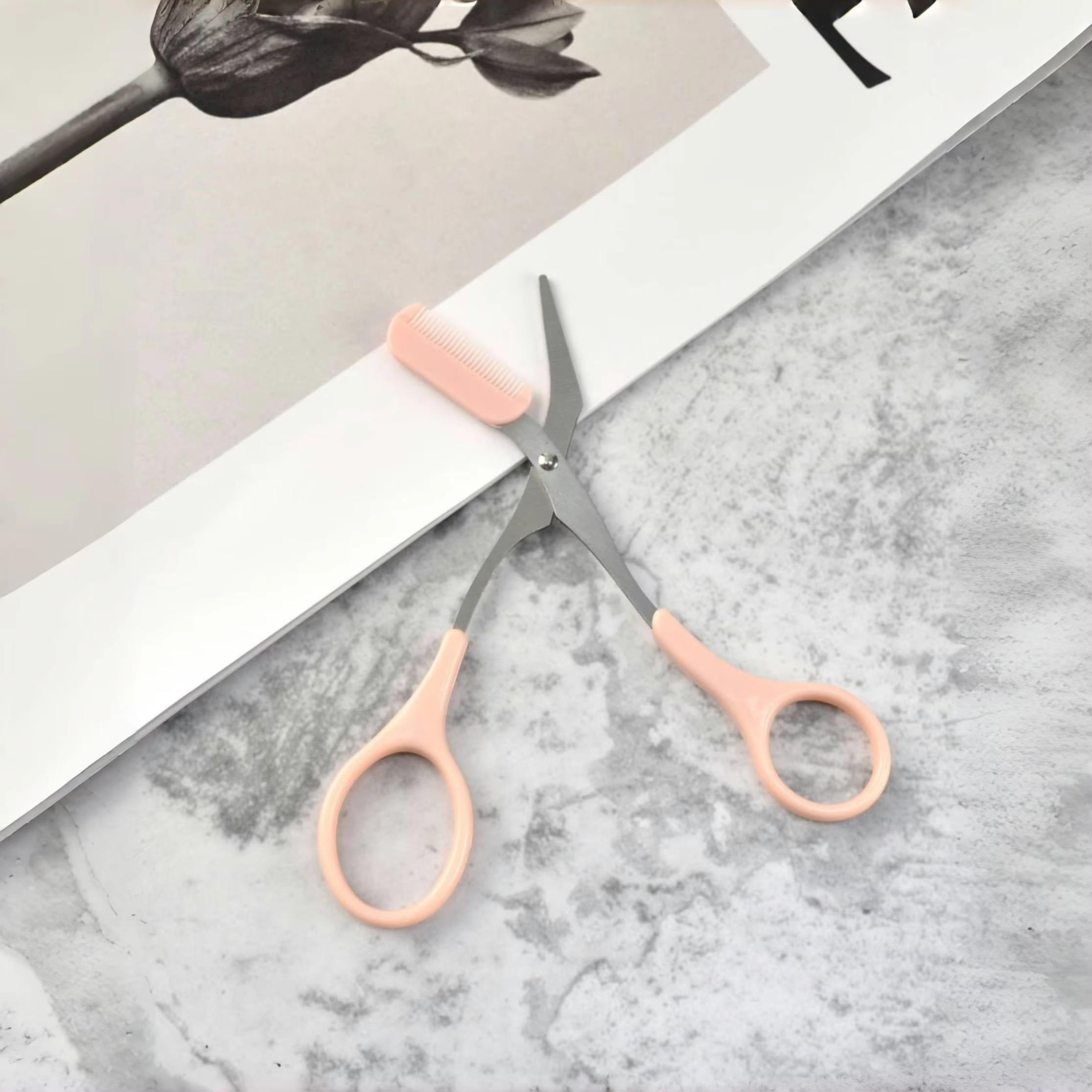 Pink eyebrow trimming scissors with built-in comb - stainless steel, precise grooming tool, creating perfect eyebrows